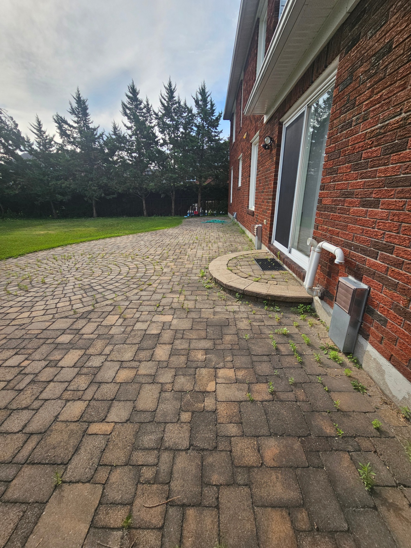 Large back patio pressure wash and re-sanding before